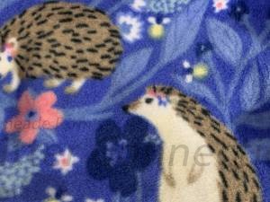 Hedgehogs with flowers on blue