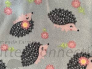 Gray hedgehogs and flowers